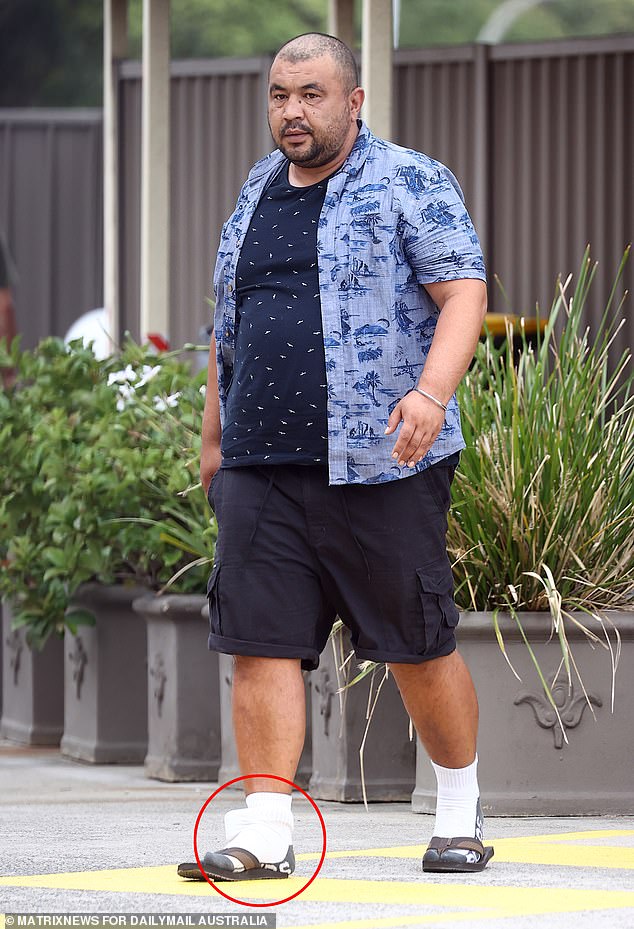 A recently released immigration detainee living in a western Sydney motel at taxpayer expense was previously jailed for procuring a child for sex.  Rahmatullah Rezaei is pictured wearing an ankle monitor at the motel