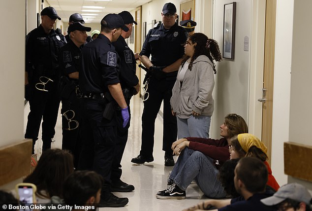 After refusing police orders to leave a locked building, 56 students, including O'Neill, were arrested for trespassing, and subsequently placed on disciplinary probation