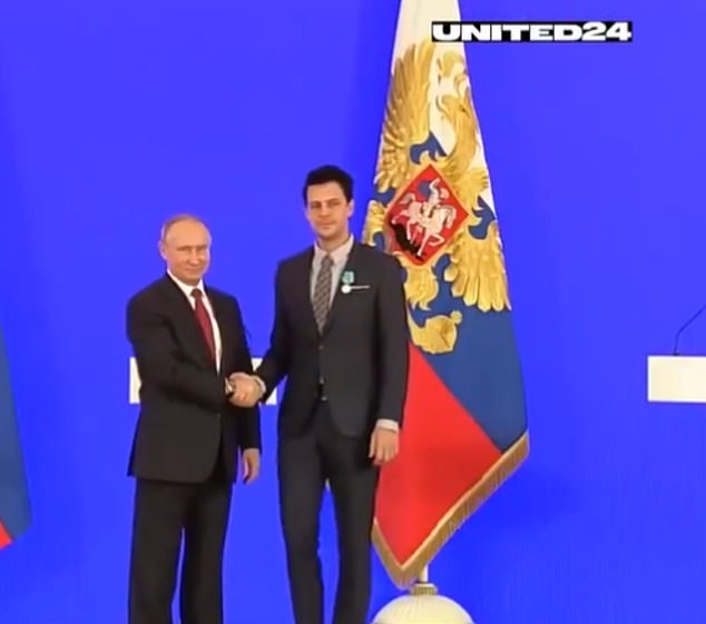 The ministry published a video of Biković, 36, (pictured, right) shaking hands with Vladimir Putin (pictured, left) during a ceremony where he received a top cultural prize