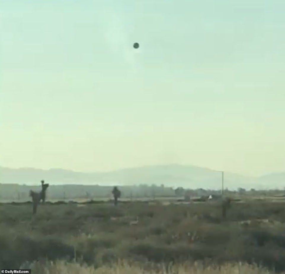 Andy Segobia, 52, shared images of what appeared to be a dark orb UFO hovering outside El Mirage Airport near Adelanto, California in August 2020.