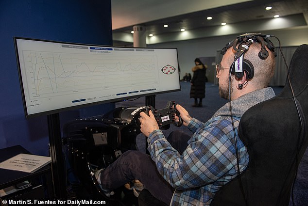 Before the driving simulation started, Macnica employees calibrated the EEG device to properly read my brain waves