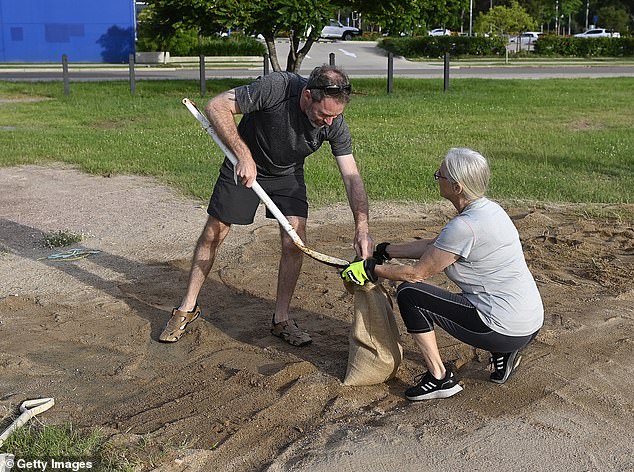 Townsville residents prepare sandbags for the arrival of Cyclone Kirrily