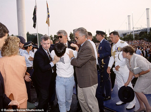 Charles, who was speaking in Sydney to mark Australia Day, remained remarkably calm as Kang, who is now a lawyer, was pushed to the ground before being led away.