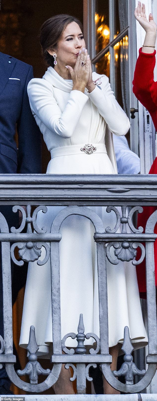 There were some hidden meanings in her outfit.  She chose a white dress by Danish designer Soeren Le Schmidt, which represents 'renewal and the purity of the crown'