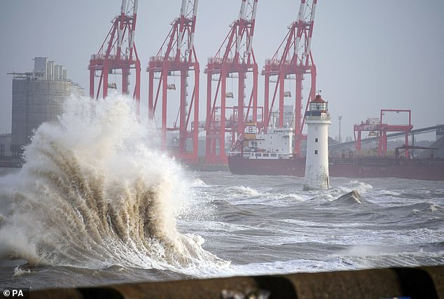 Storm Jocelyn has caused dangerous conditions and new travel disruptions across much of Britain.  Pictured: Waves on New Brighton beach, Wirral