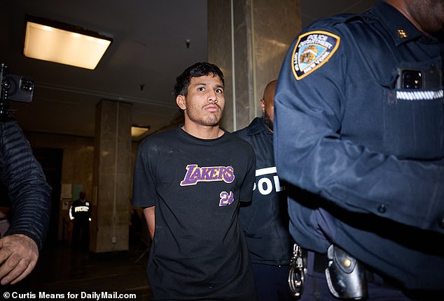 Boada, who has yet to have a court hearing, was escorted by an officer while wearing handcuffs and a Lakers t-shirt.