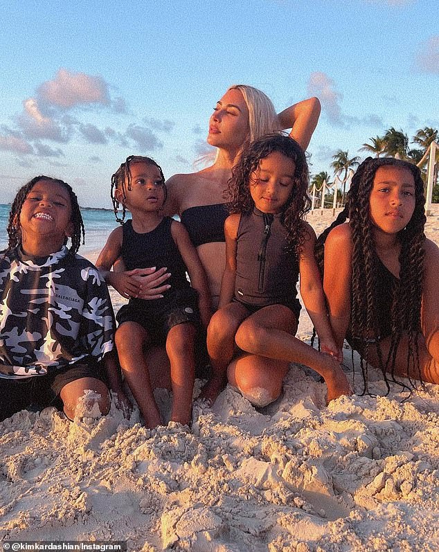 Kim pictured with her four children (L-R) Saint, eight, Psalm, four, six-year-old Chicago and 10-year-old North.  Her two youngest children were born via surrogate mother