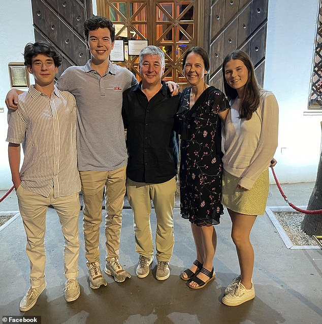 Gill, seen here with his wife and three children in a photo taken just two weeks before he was shot