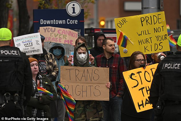 Counter-protesters are seen in Calgary on September 20 calling for an end to the 'harassment' of trans children