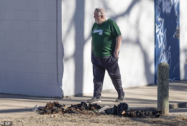 The statue was thrown into a garbage bin and set on fire, destroying the remains