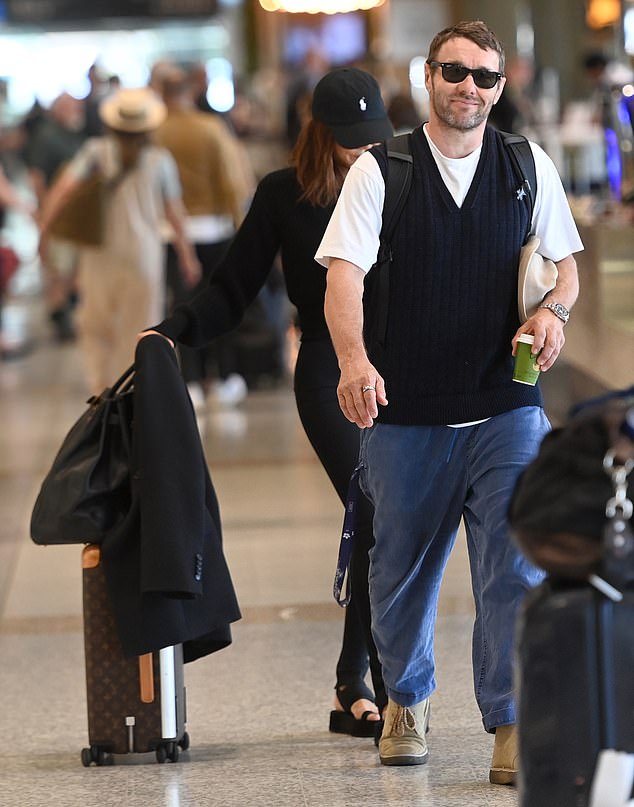 Hollywood star Edgerton, 49, opted for a smart casual ensemble, with a crisp white T-shirt paired with a navy blue cardigan and jeans