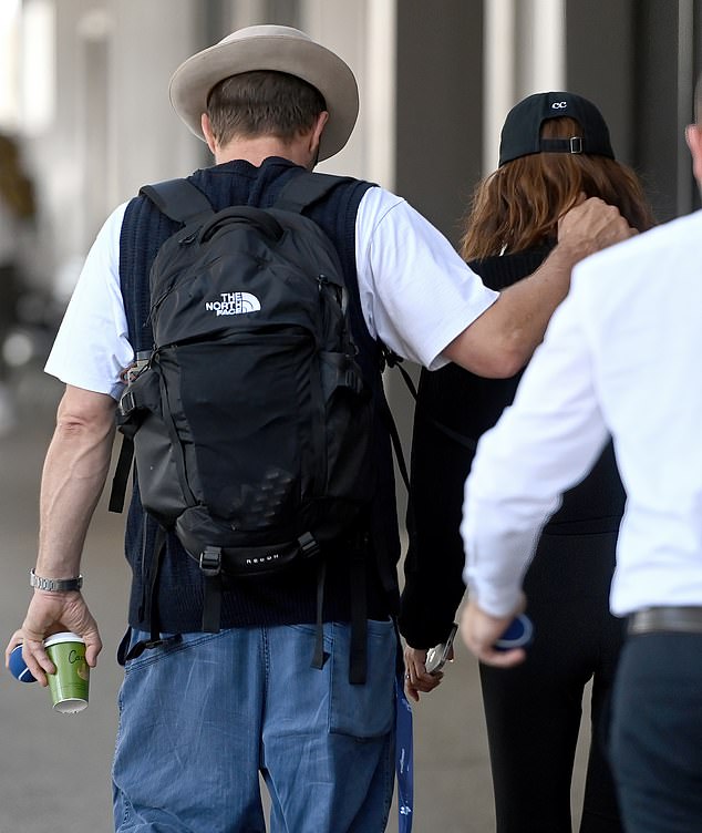 At one point, Joel was seen putting his arm around his beautiful partner as they walked to their waiting transport