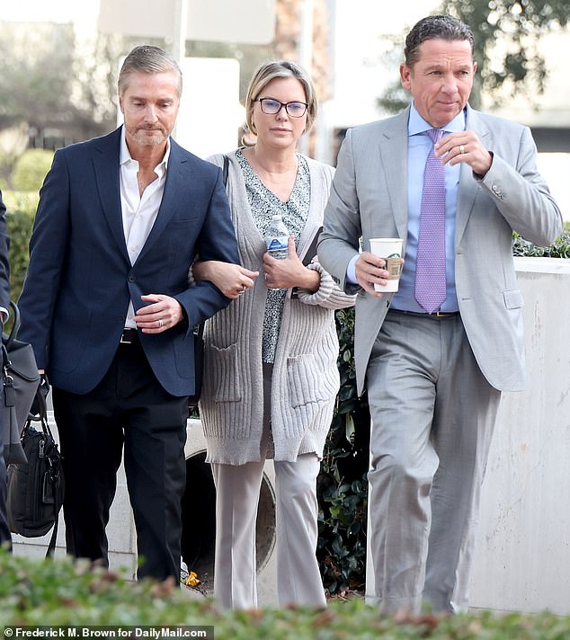 The deputy testified that Grossman begged him to let her call her husband (with whom she is pictured here on the left), Dr.  Peter Grossman, who heads the Grossman Burn Center – because her husband could “help the kids.”