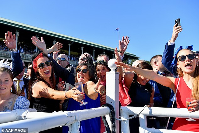 Australians have to wait until their late 30s to be above average, while the 35 to 39 age group has an average personal income of $76,200 (pictured are spectators at Sydney's Royal Randwick Racecourse)