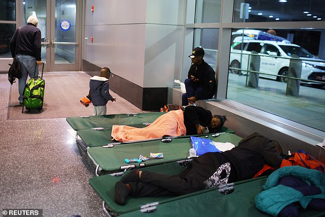 Migrants are pictured sleeping at Logan Airport in November.  The CEO said the situation was not sustainable and cleared them up, but they have returned