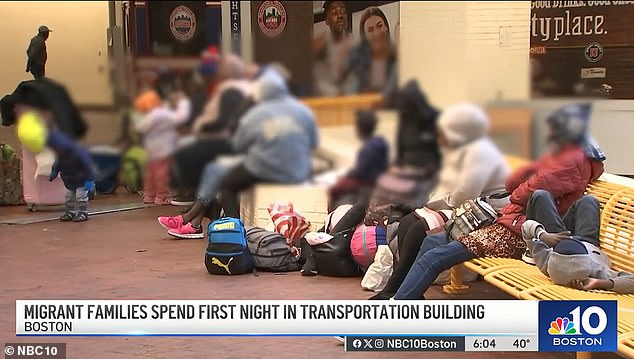 Migrants are seen camping in a state transportation building in Boston as shelters are full