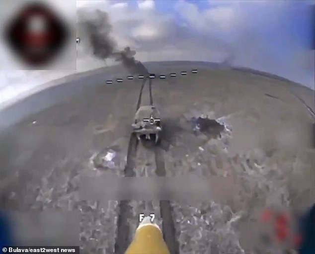 Drone-mounted cameras show the UAVs speeding toward the Russian tanks, with the video cutting out just before they hit their targets