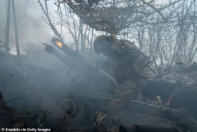 Ukrainian soldiers fire an artillery gun at the front line, towards Kreminna, as the war between Russia and Ukraine continues in Donetsk Oblast, Ukraine, on January 30.