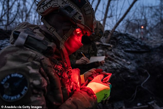 A Ukrainian soldier stands with an artillery unit on the front line, heading towards Kreminna as the Russian-Ukrainian war continues in Donetsk Oblast, Ukraine, on January 30.