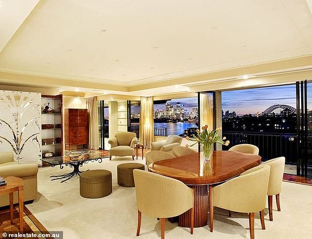 Pictured is the dining room of Mrs Denholm's penthouse in Cremorne Point