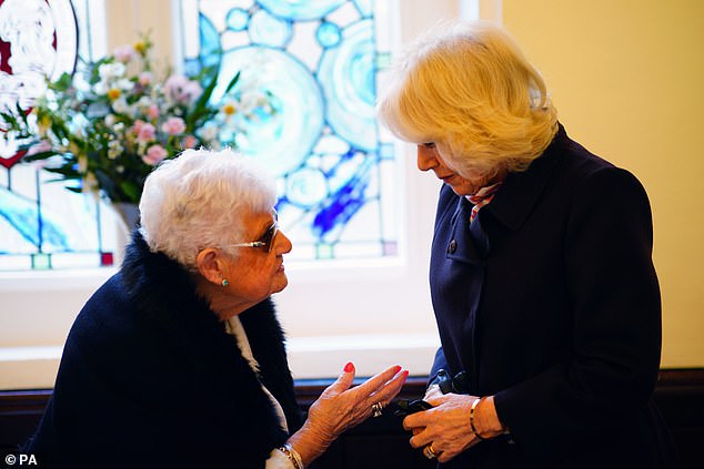 Queen Camilla meets residents of the St John's Foundation almshouse in the chapel of St Michael Within