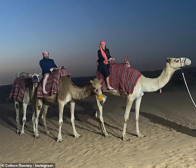 The couple looked in good spirits as they posed against the beautiful sand dune landscape before watching the sunset during a camel ride