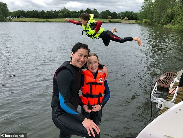 To infinity and beyond!  This mother was photobombed by her other daughter, who decided to strike a pose while jumping into the lake