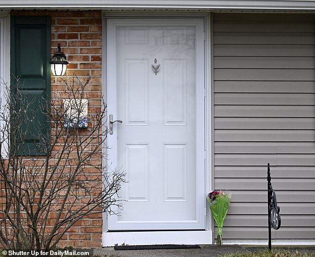 A bouquet of flowers was left at the door of Mohn's home in Levittown on Wednesday