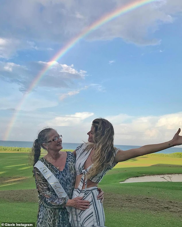 In her tribute, Gisele shared a photo with her mother on her 70th birthday, standing under a rainbow