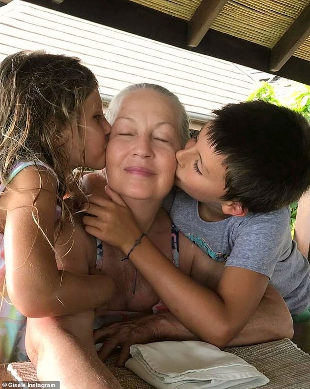 The supermodel shared a sweet photo of her children Vivian and Benjamin kissing their grandmother when they were younger