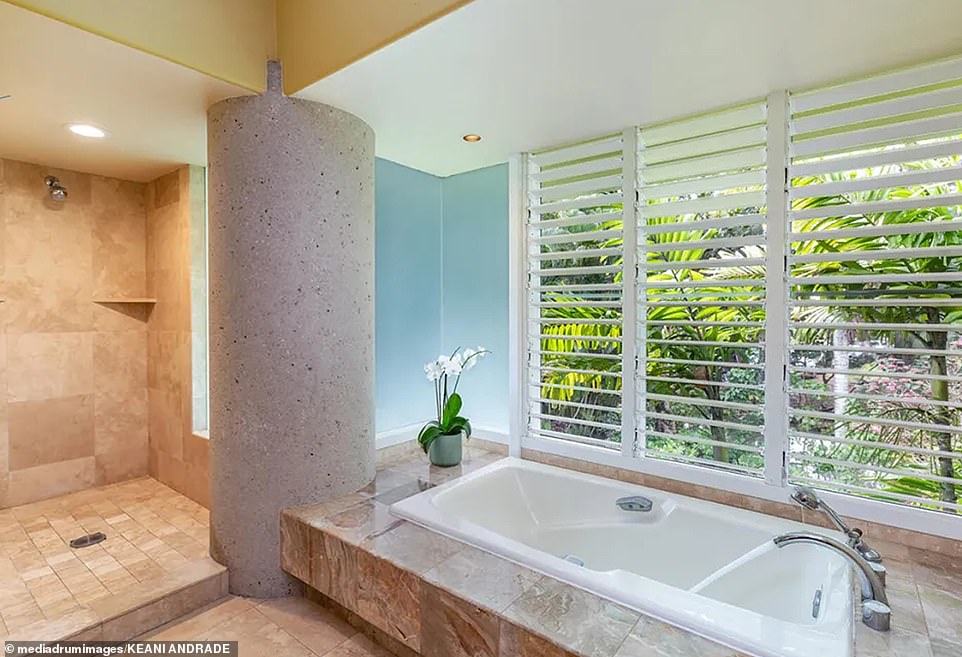 The two downstairs bedrooms share a bathroom, while the upstairs master retreat features a breathtaking oceanfront office with a built-in desk.