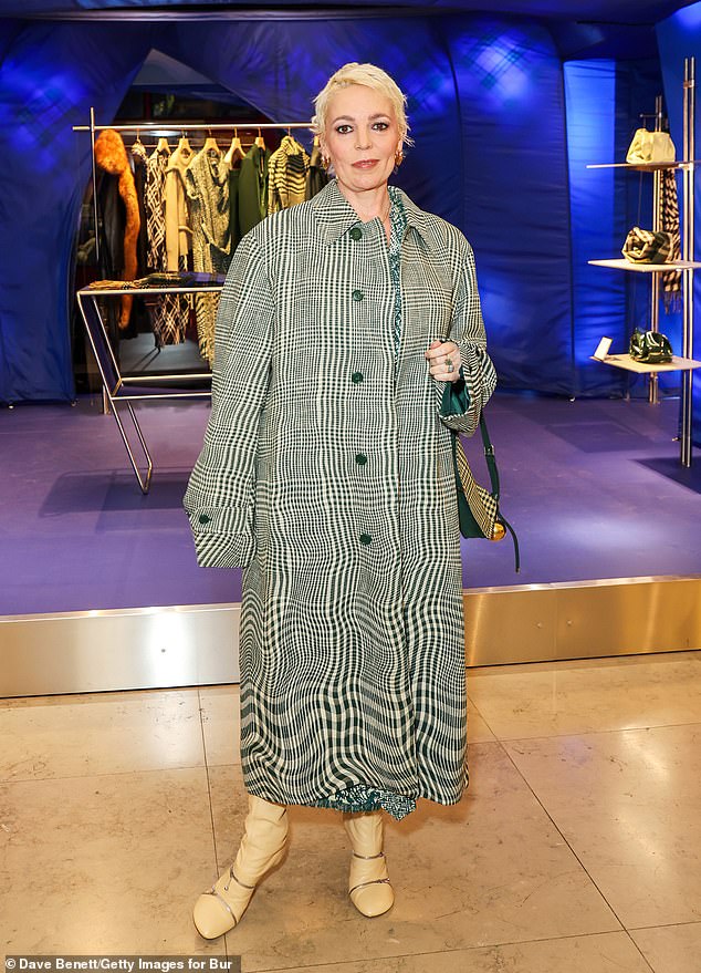 The 50-year-old actress looked stunning in a green and white checked trench coat for the event at the Brompton Road store