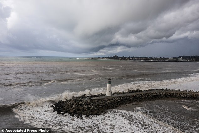 Storm clouds hang over Walton Lighthouse amid the first of two successive atmospheric rivers