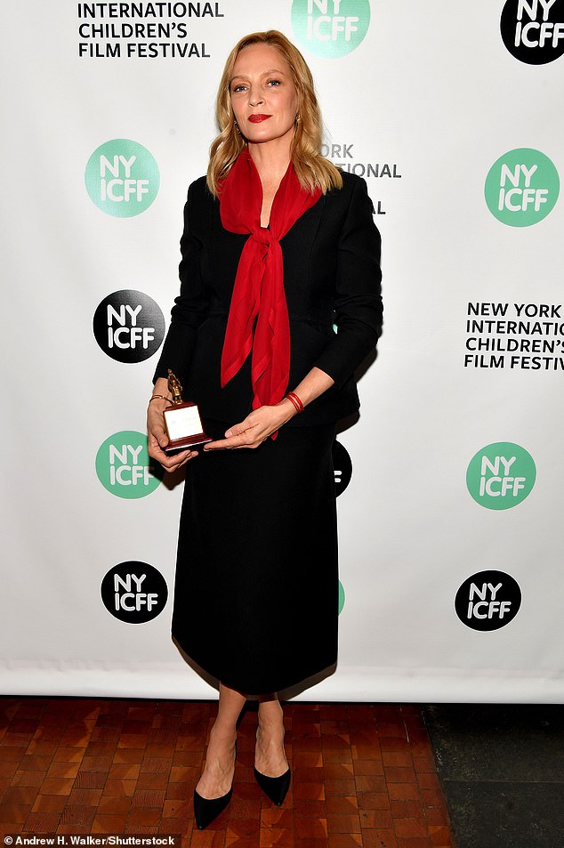 The star - who is a longtime NYICFF judge - dressed to impress in a black skirt that fell straight down and stopped a few inches above her ankles