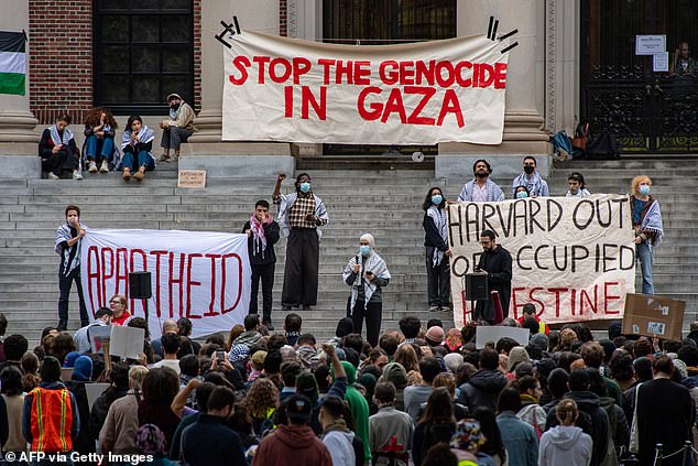 On October 14, demonstrators are seen at Harvard calling for an end to 'apartheid' and 'genocide' in Gaza