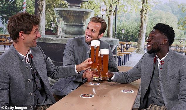 Bayern Munich superstar Harry Kane posed alongside teammates Thomas Muller and Alphonso Davies during a photoshoot with Bayern's partner Paulaner, wearing traditional lederhosen