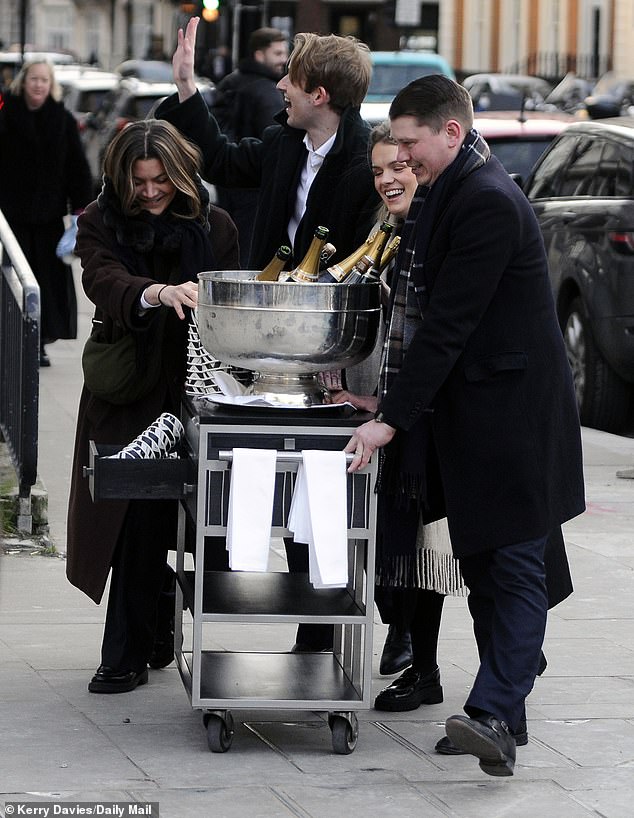 The bubbles were wheeled to the staff who were waiting for a glass