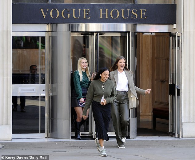 Employees beamed as they left the office and gathered outside for champagne and sweets