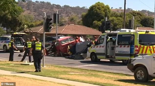 A crumpled red car was seen on the central reservation