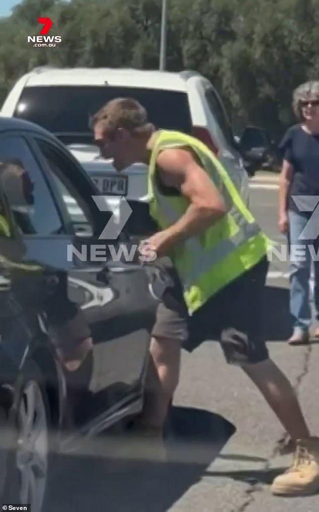 The pair exchanged a few blows before casually driving away when the light turned green