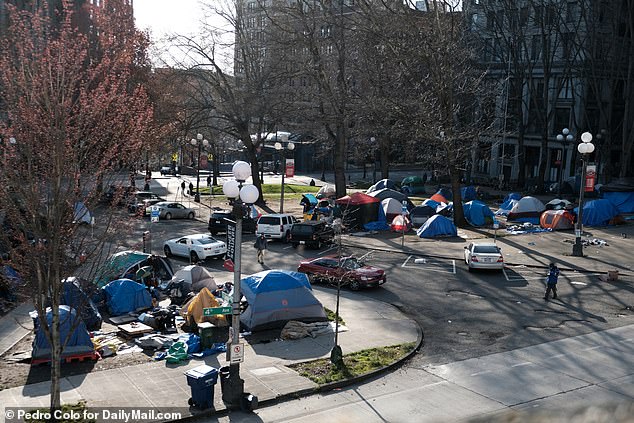 This twisted dogma has also taken hold in neighboring Washington state, where a three-week-old baby boy has now sadly been added to the long list of victims resulting from his malicious approach to America's ever-expanding addiction crisis.  (Above) Homeless camp in Seattle, Washington