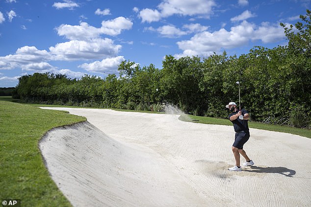 Rahm plays a shot from a bunker during his practice round in Mexico on Wednesday