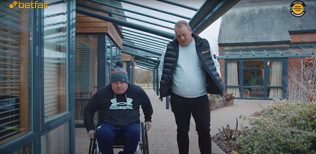 Betfair tipster Daryl Cater (right) visited the Injured Jockeys Fund to meet staff and residents, including Wayne Burton (left) who will take part in this year's London Marathon