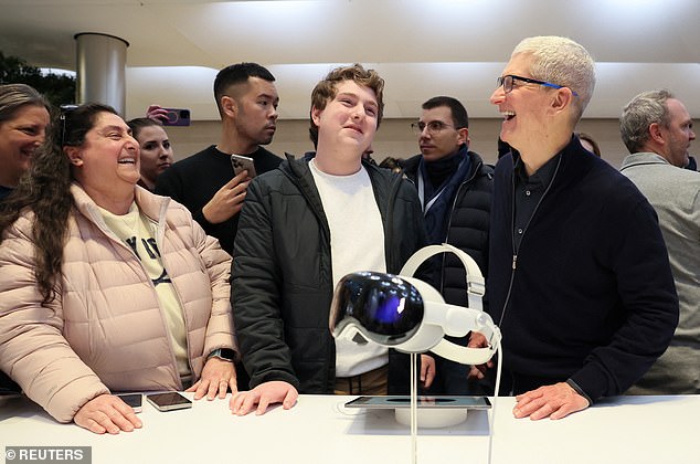 Cook chatted with customers at the New York store, which was full of people wanting to test out the Vision Pro headset