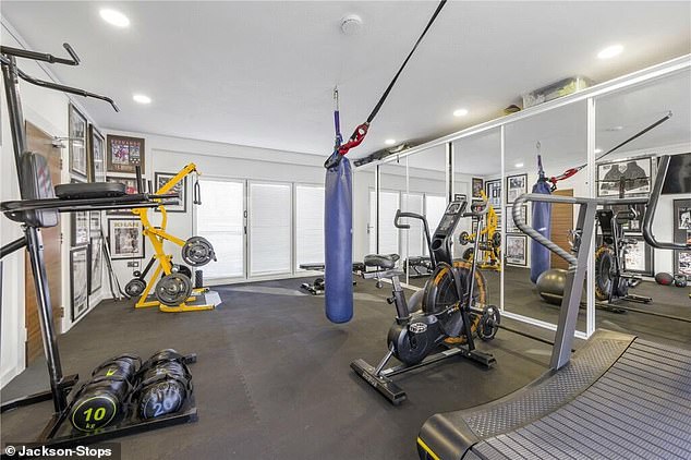 The couple have created a gym in the house, with various machines and floor-to-ceiling mirrors