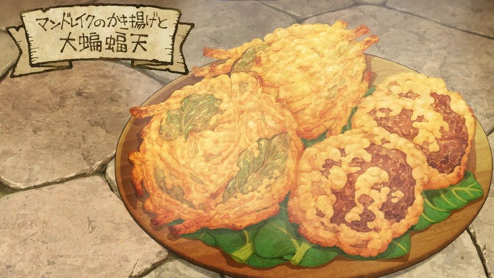 Four flaky-looking batches of breaded food, perched on a bed of leaves on a wooden platter.