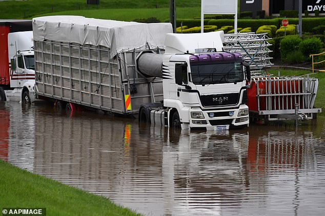 Local residents and authorities are already facing devastation in the state's northwest following former Tropical Cyclone Kirrily, as they brace for a new tropical cyclone threat (photo of a flooded road in Queensland)