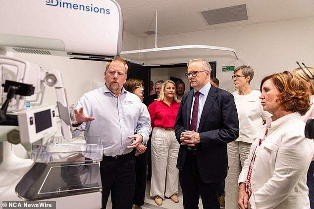 Prime Minister Anthony Albanese (centre) is seen visiting Frankston Hospital on Saturday to make the breast cancer announcement