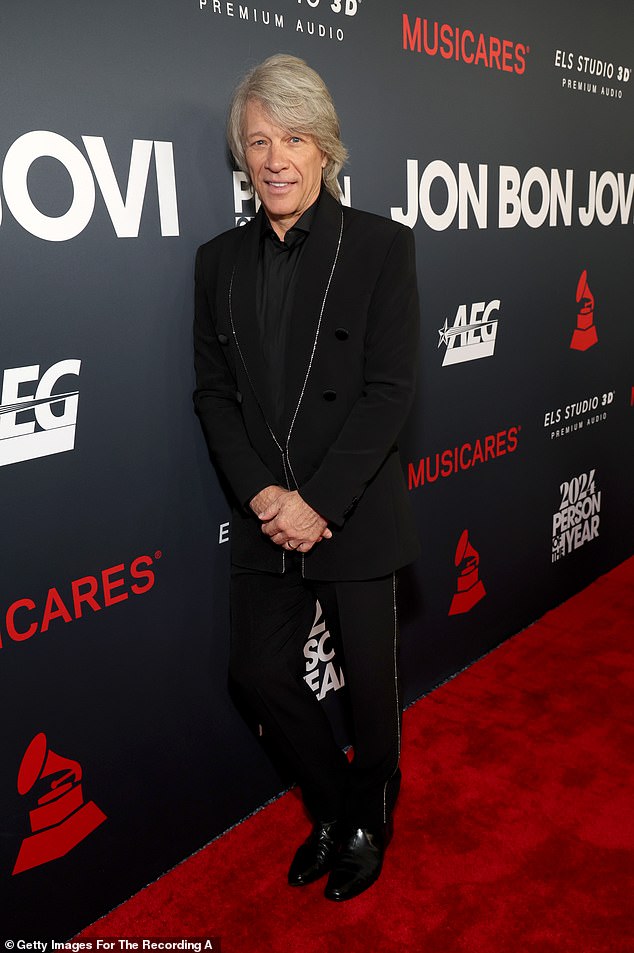 Jon arrived on the red carpet looking dapper in a crisp black suit with glittering accents