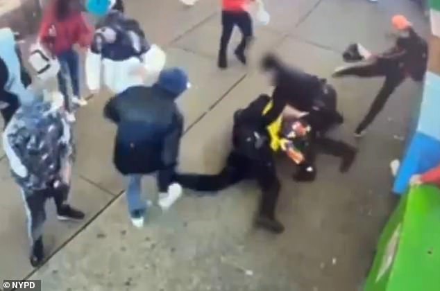 Surveillance footage shows more than a dozen hooded men attacking the two officers after they tried to detain one of the men